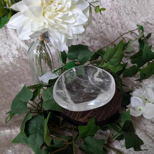 Clear Quartz bowl in boho decor setting surrounded by ivy and flowers