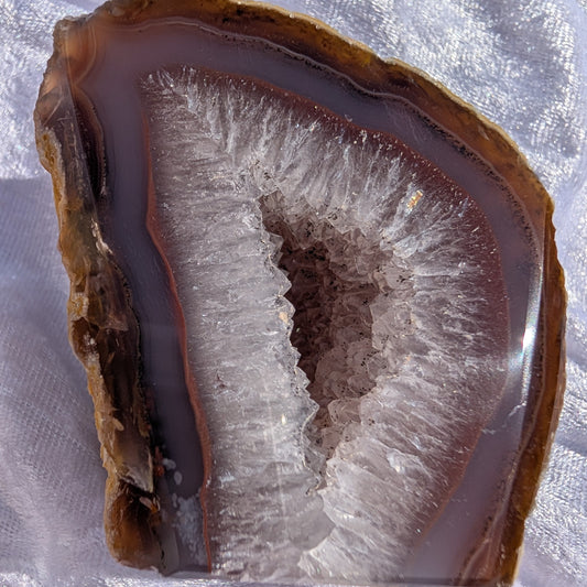 Close up of red banded agate with quartz druzy geode