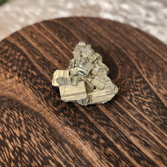 High quality Peruvian Pyrite Cluster displayed on wooden circular stand