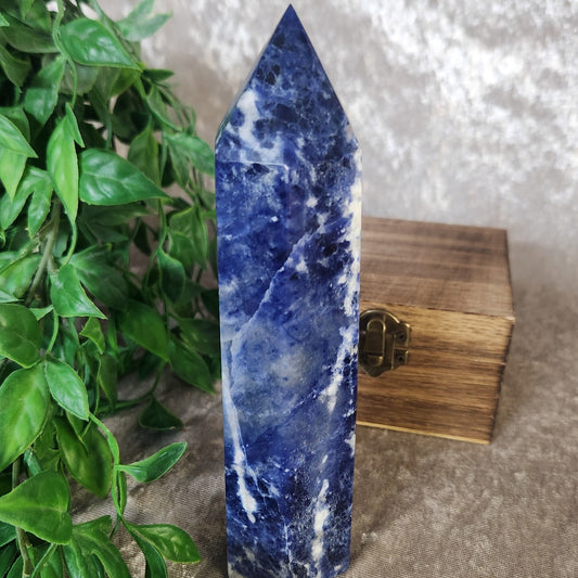 Polished sodalite tower showcasing natural marbled patterns