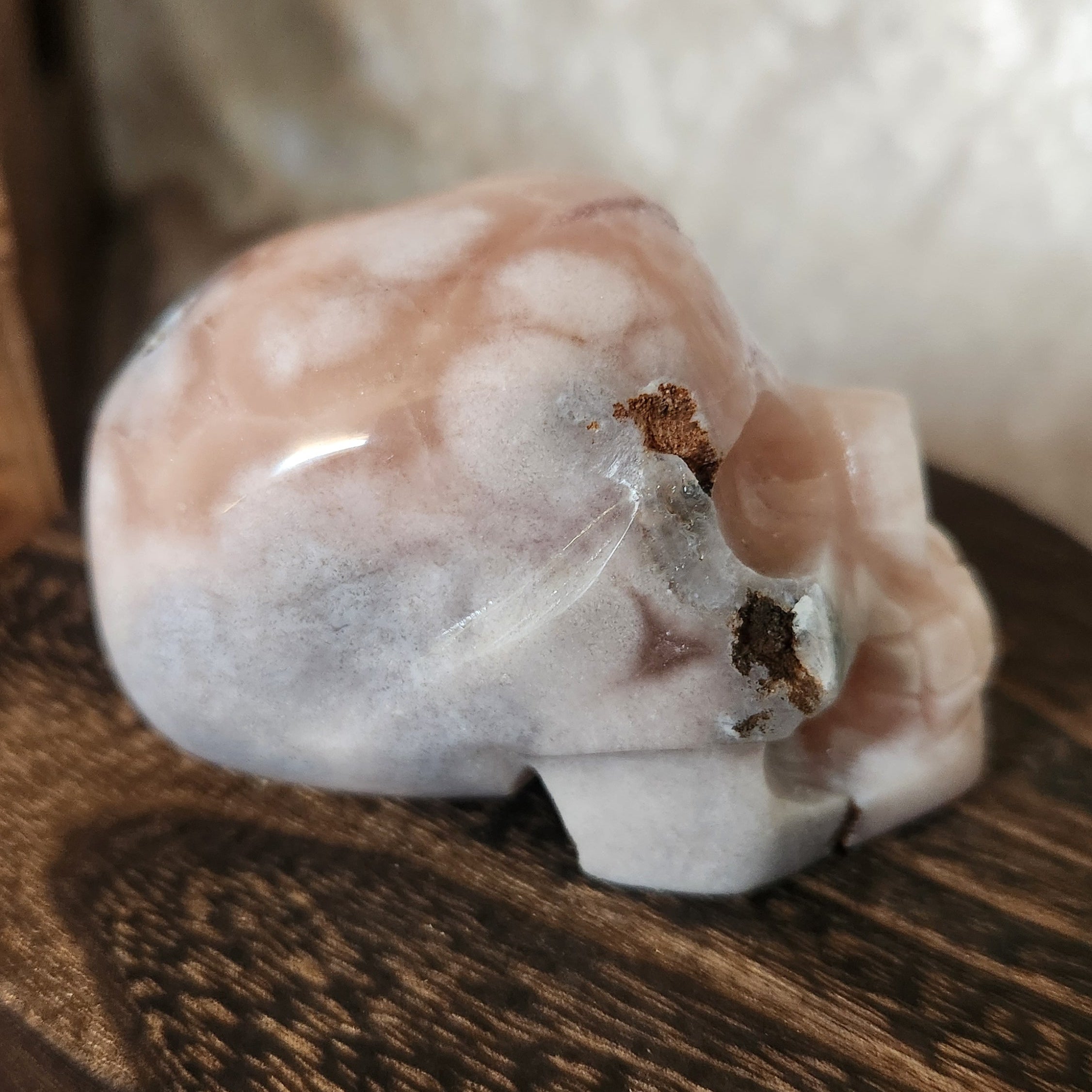 Pink amethyst crystal skull with soft lavender druzy texture