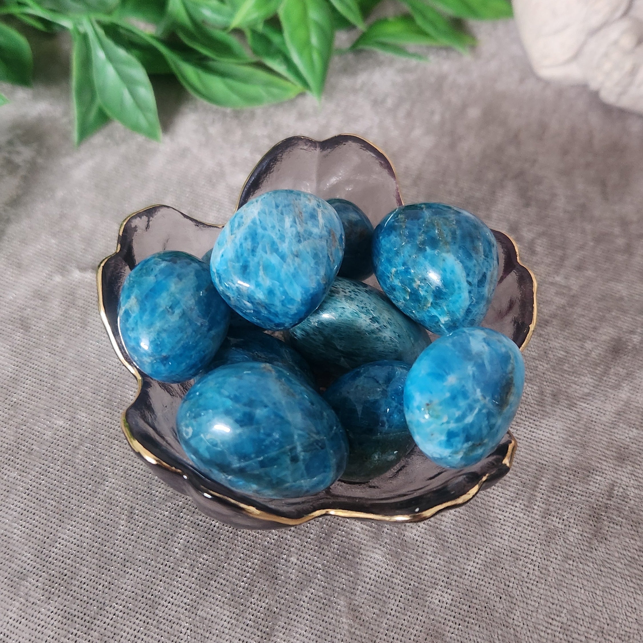 polished blue apatite tumbles in vintage boho decor style setting