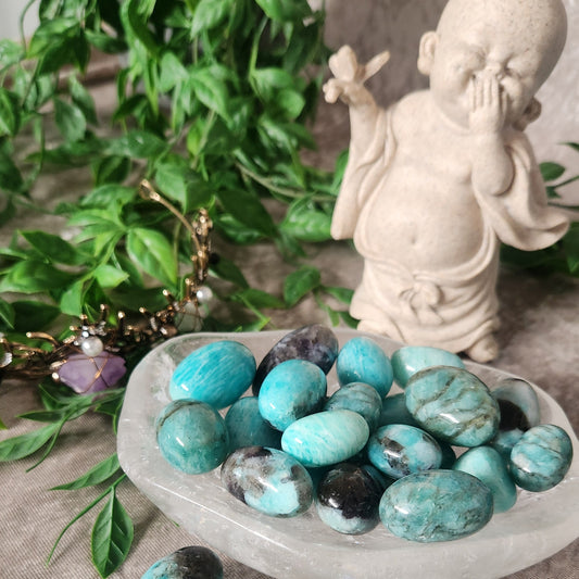 Smoky Amazonite tumbled stones displaying teal-green tones with natural smoky quartz inclusions.