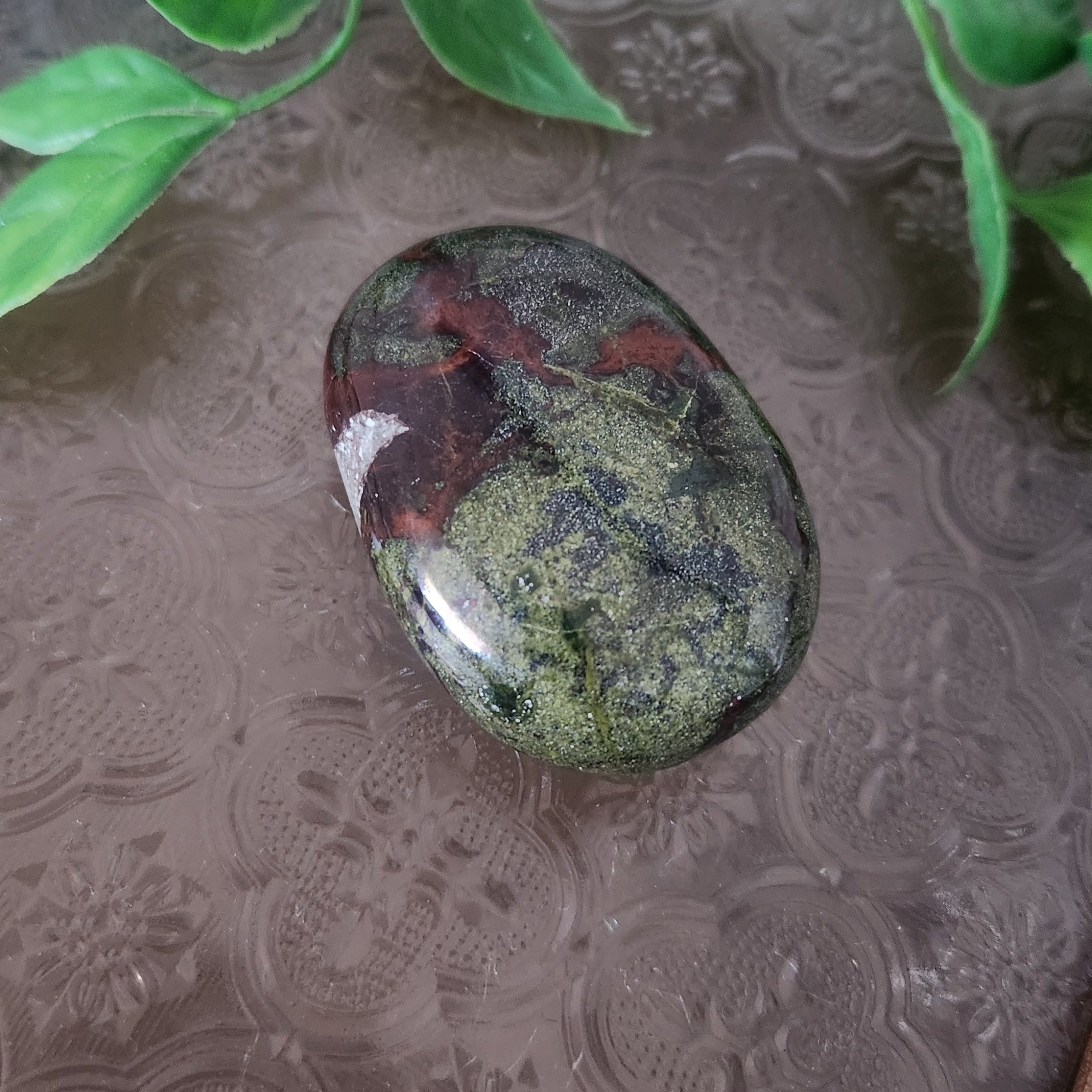 Dragon Blood Jasper palmstone for strength, courage and life-force energy