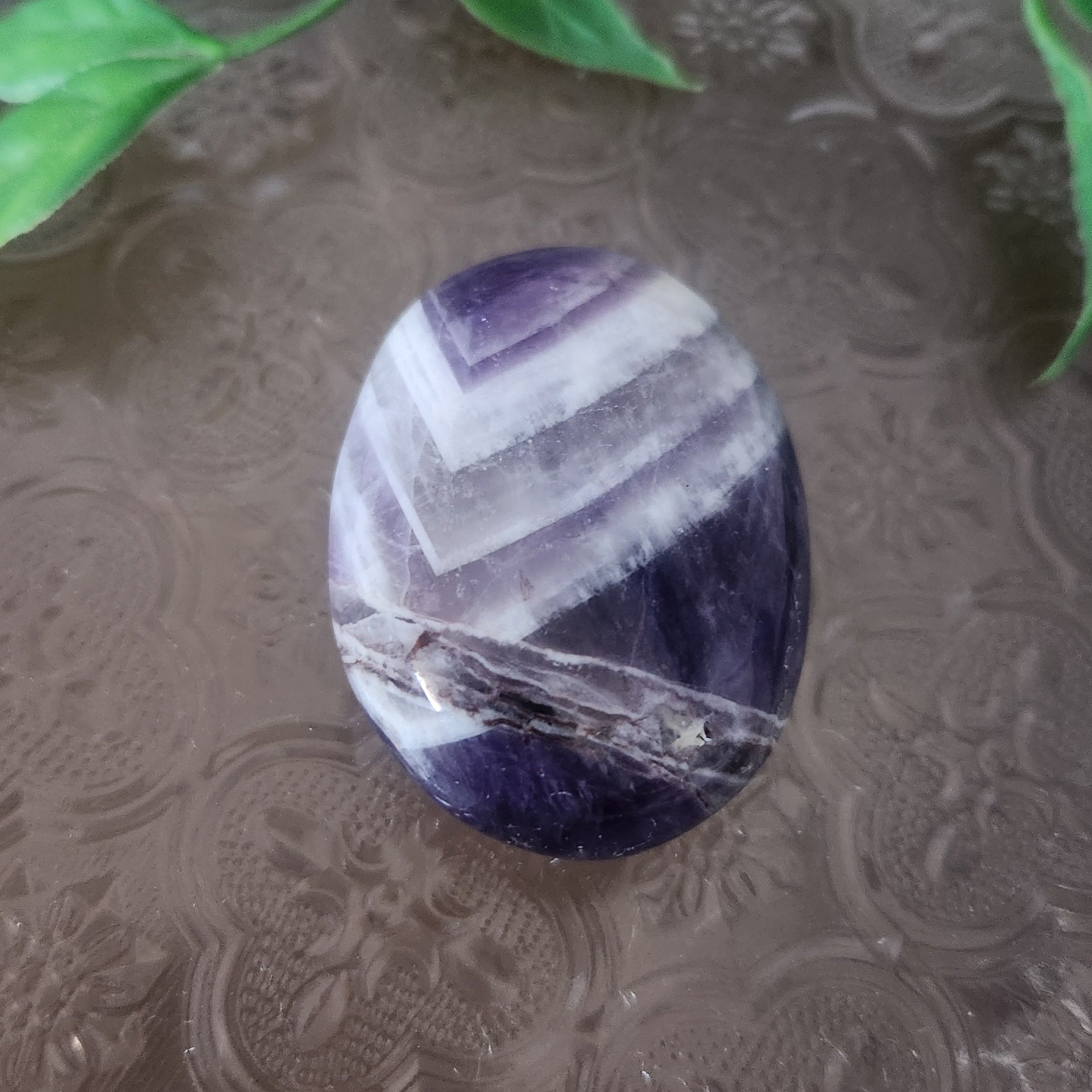 Chevron Amethyst palmstone for intuition, calm and spiritual clarity