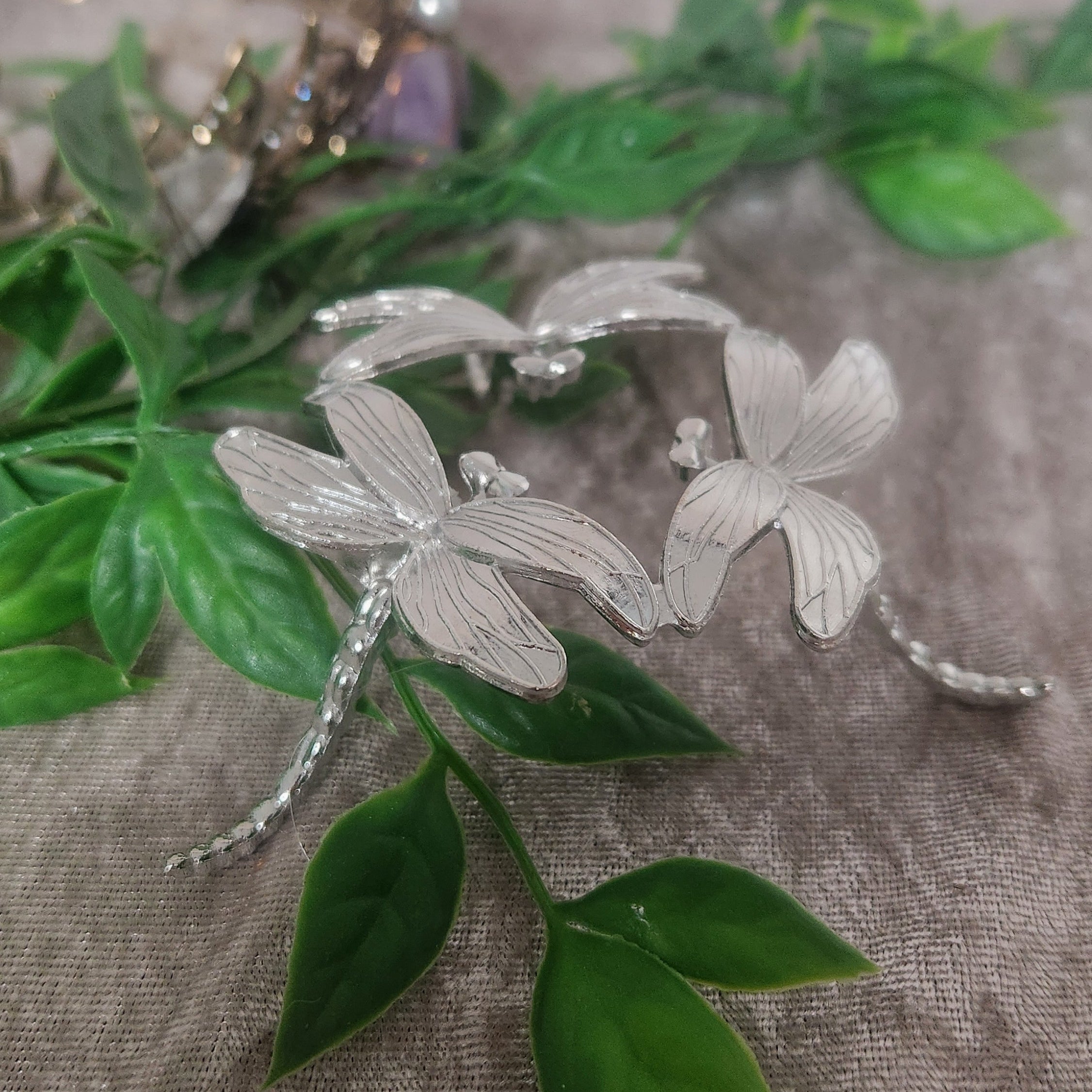 Silver dragonfly crystal stand for displaying a sphere — statement decor