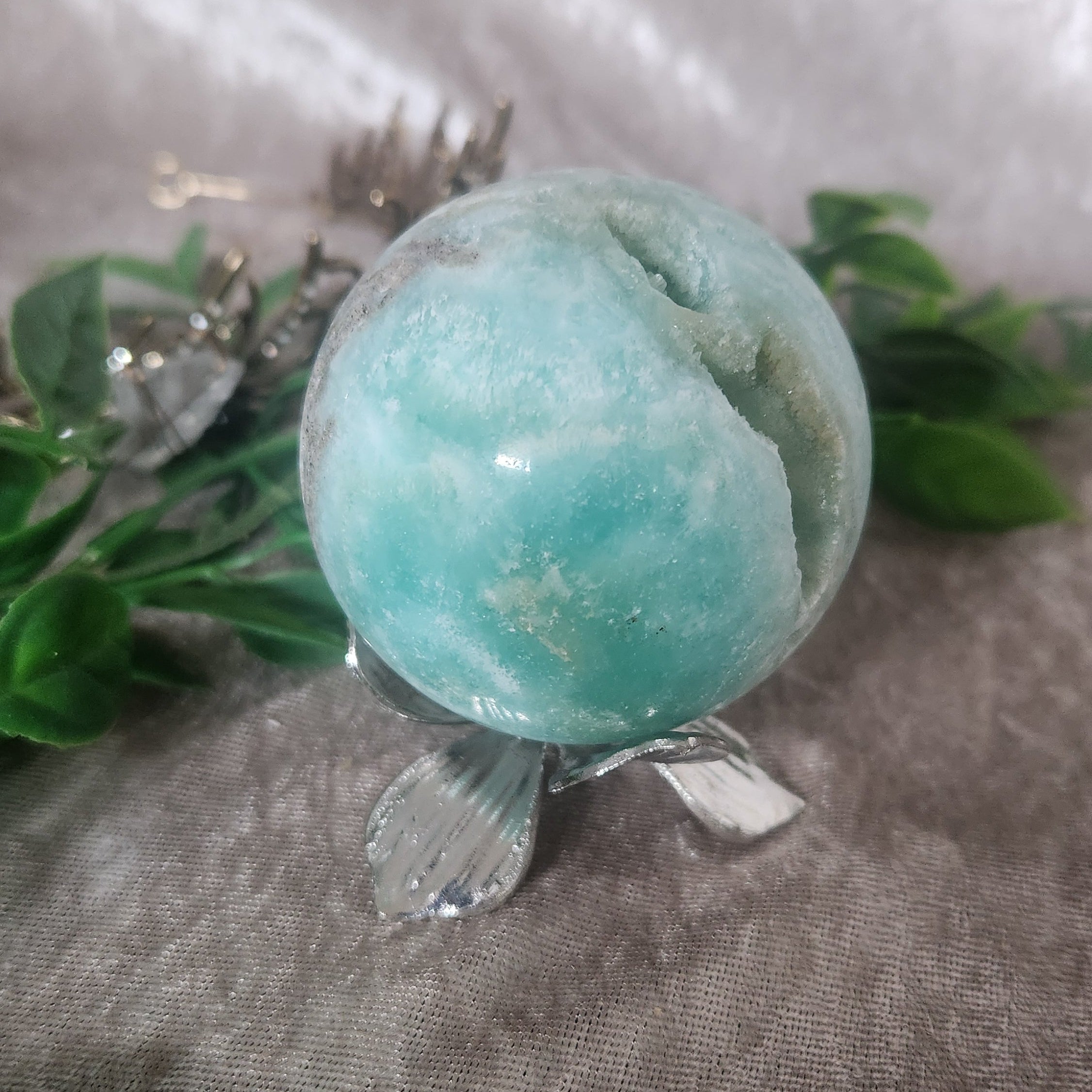 Silver wildflower boho decor sphere holder with hemimorphite sphere displayed