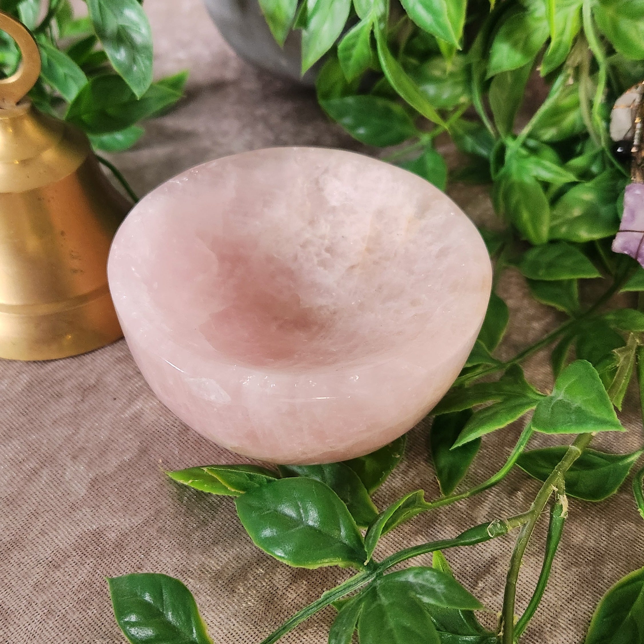 Polished rose quartz bowl with soft blush tones, decorative crystal piece for calm and harmony