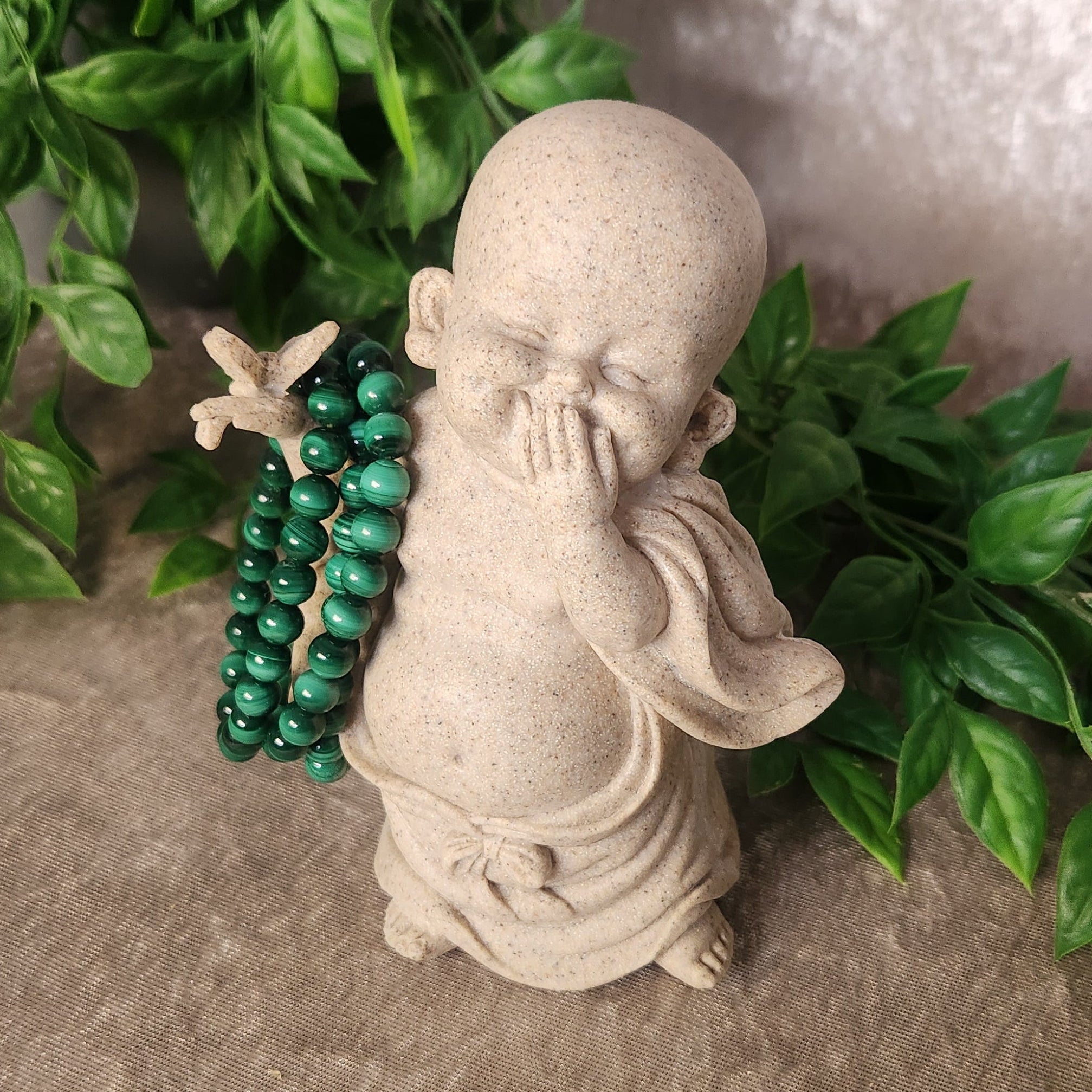 Malachite beaded bracelet with natural green banding, worn for transformation and emotional healing