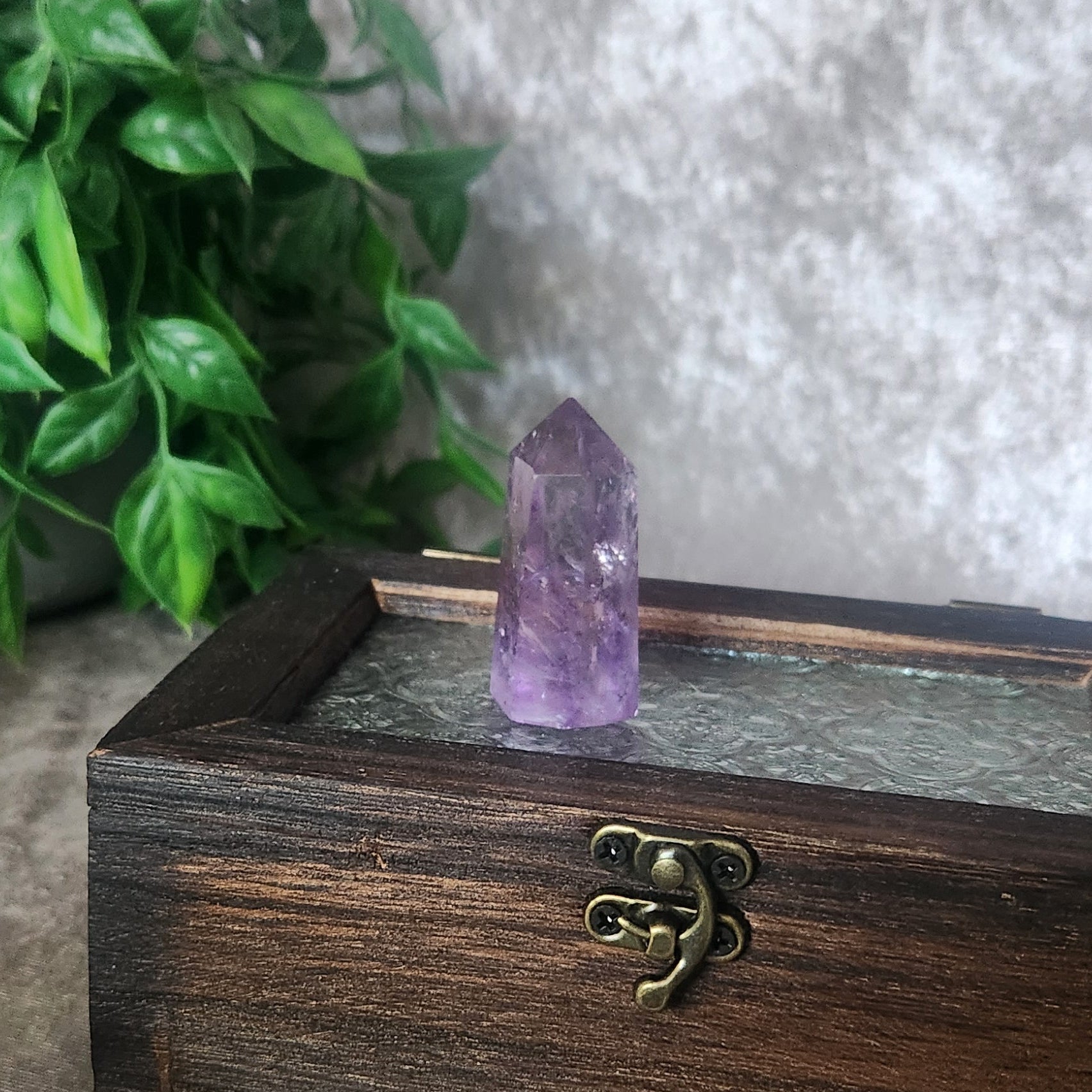 Small Brazilian amethyst towers with natural inclusions and smooth polished crystal tips