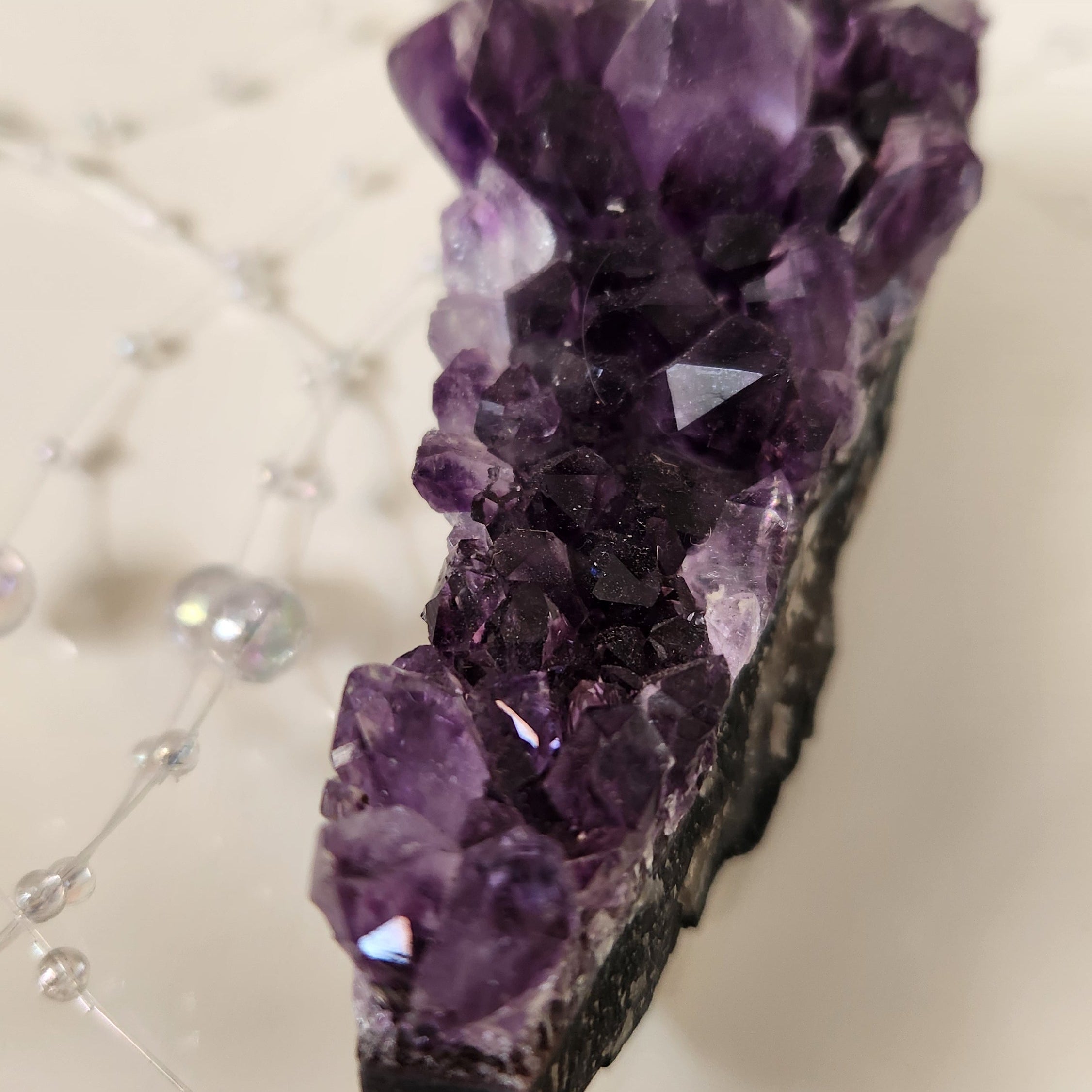 Close-up of amethyst cluster points showing natural crystal growth
