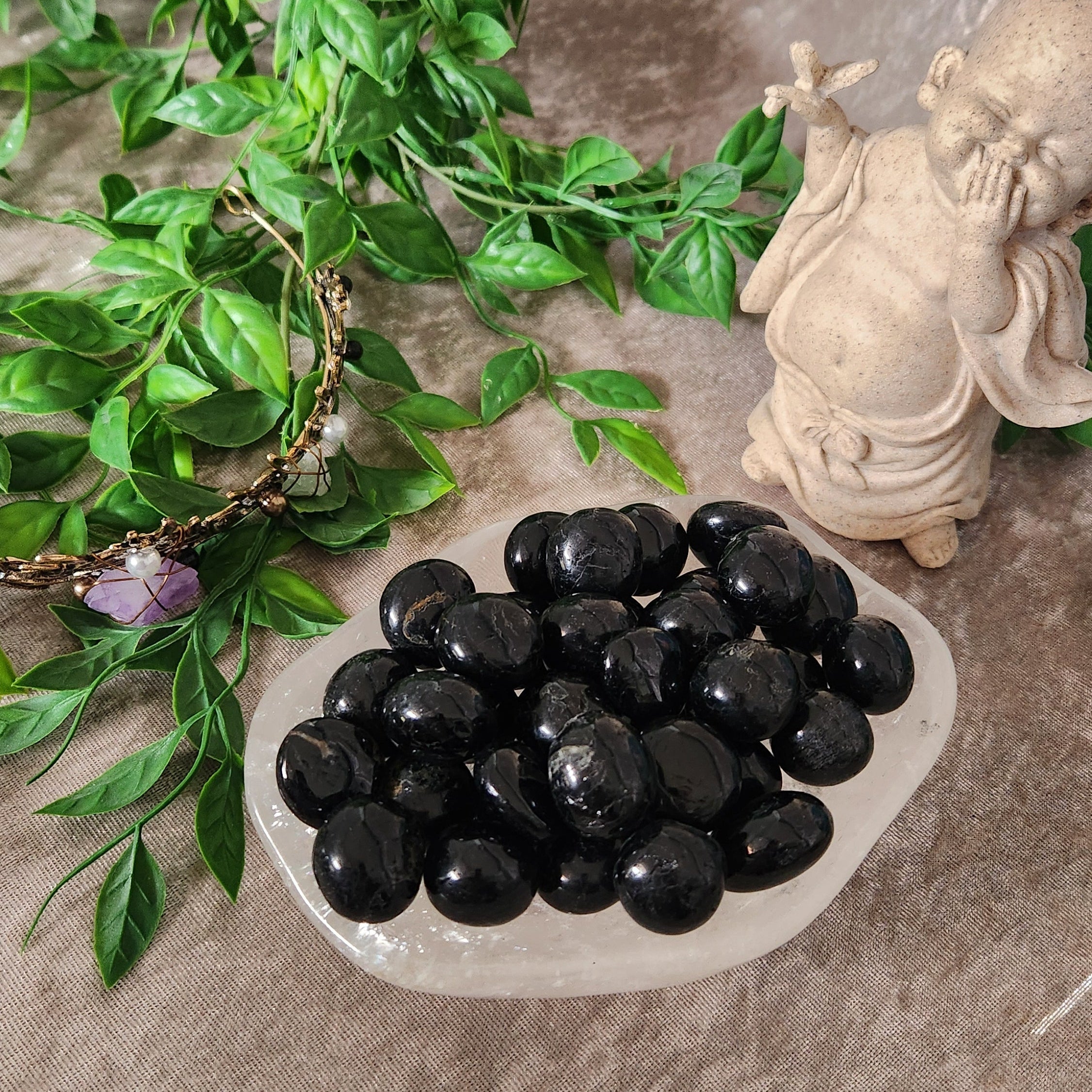 Polished Black Tourmaline tumble stone showing natural texture used for protection and stability