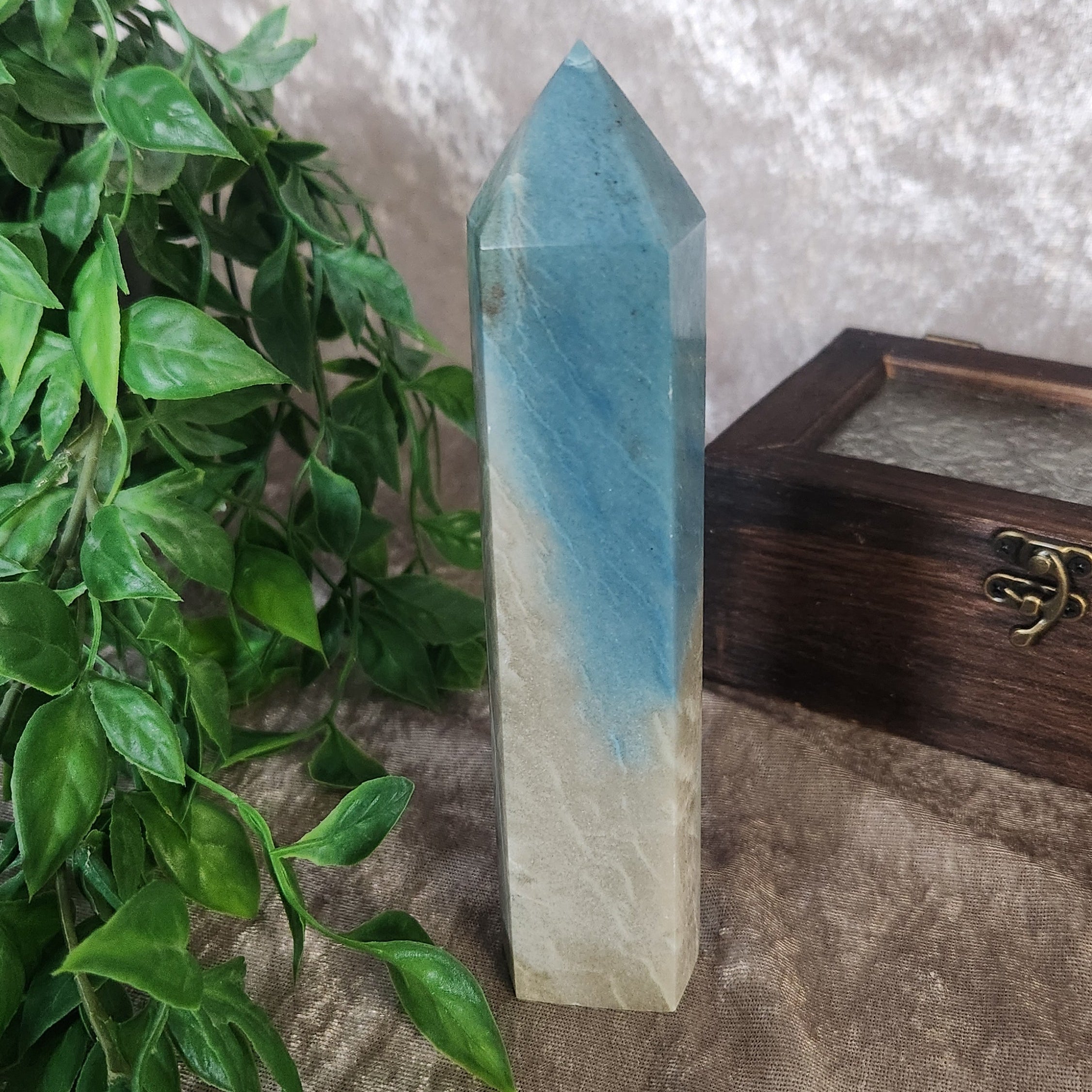 Polished troilite tower showing deep grey colouring and natural stone patterning