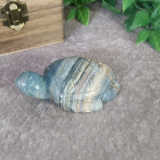 Blue onyx turtle crystal carving with polished stone finish