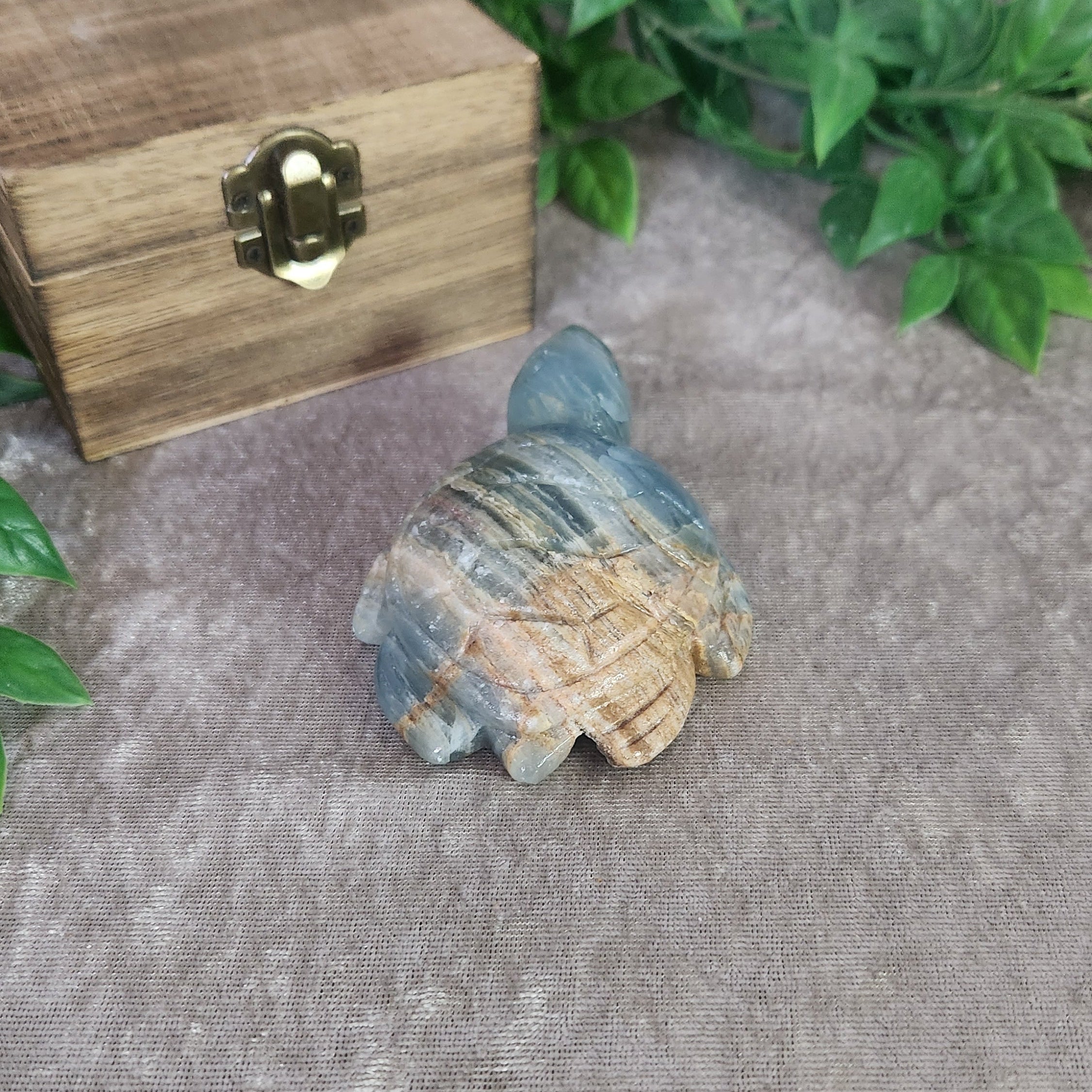 Hand-carved blue onyx turtle crystal with smooth glossy surface