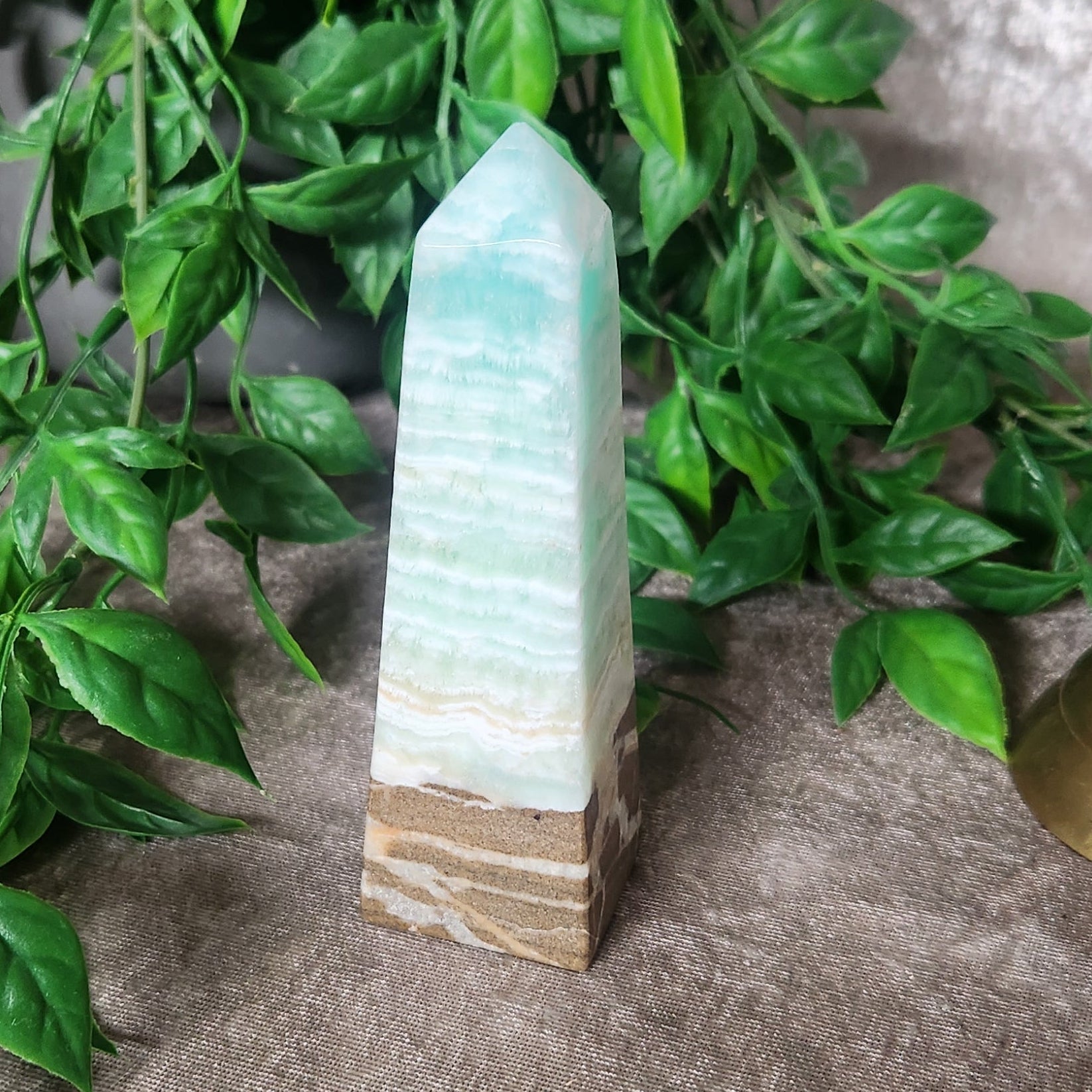 Caribbean calcite tower crystal with blue and cream banding in polished finish