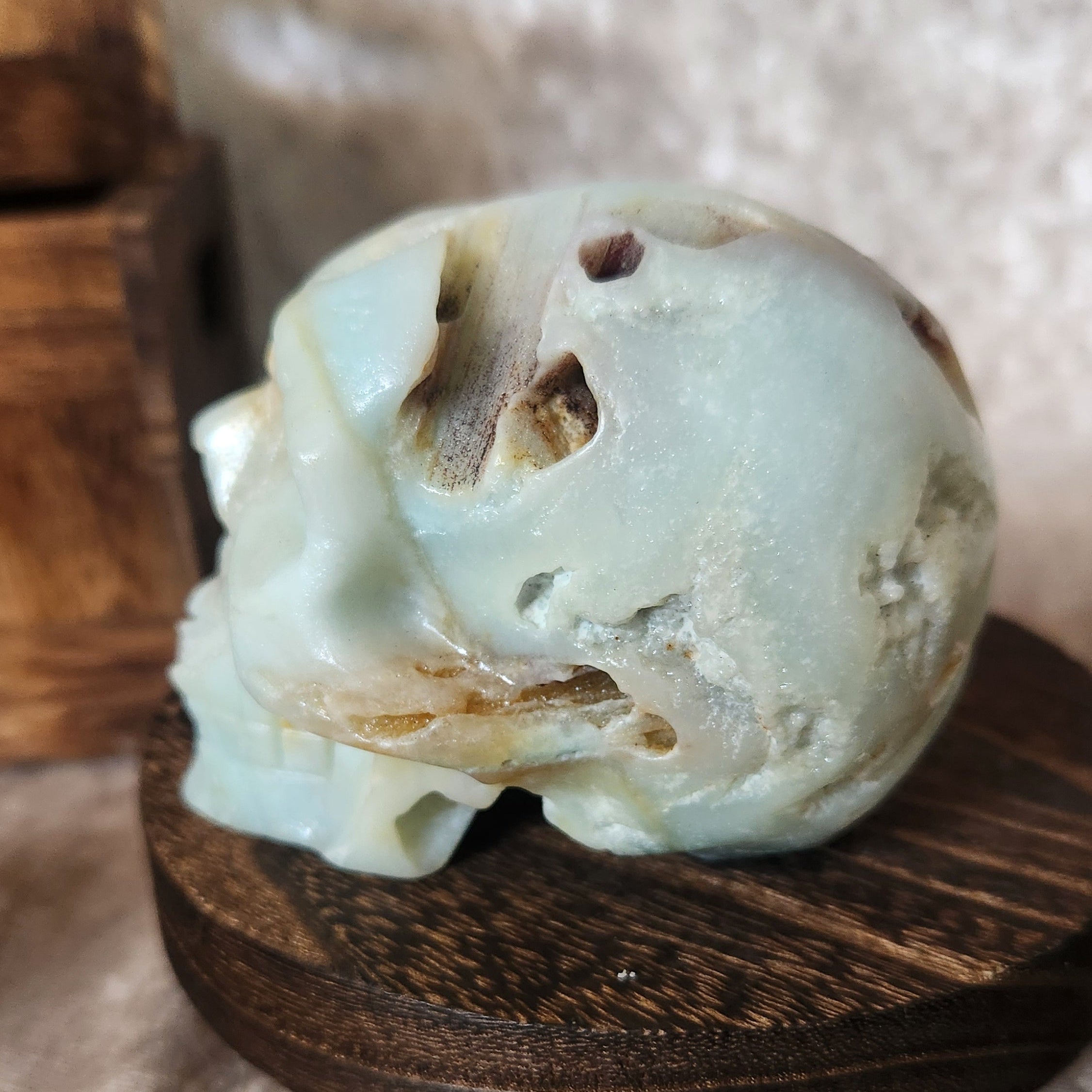 Polished Caribbean calcite skull crystal carving