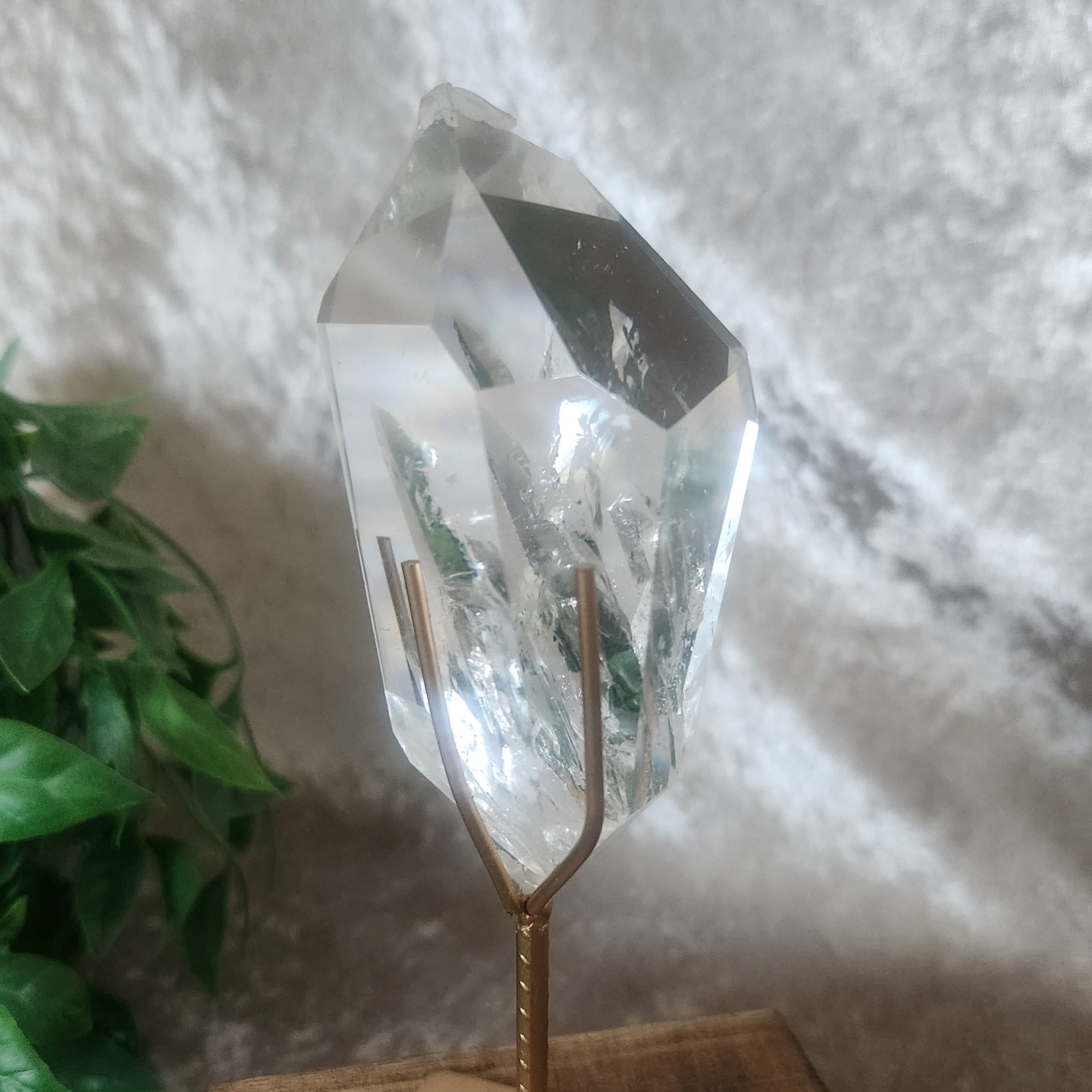 Natural clear quartz point with internal fractures and clarity from Brazil