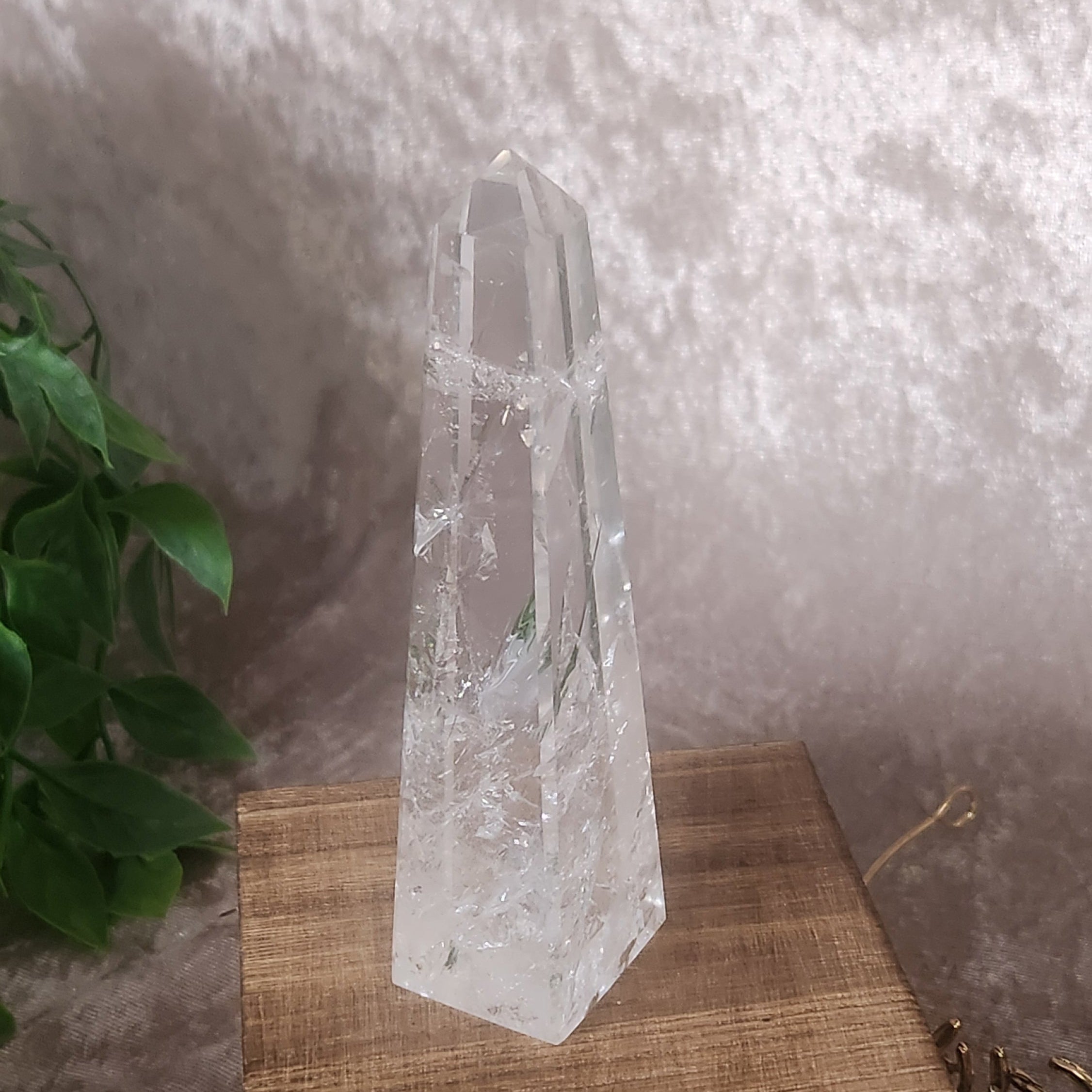 Polished clear quartz tower from Brazil on wooden display box