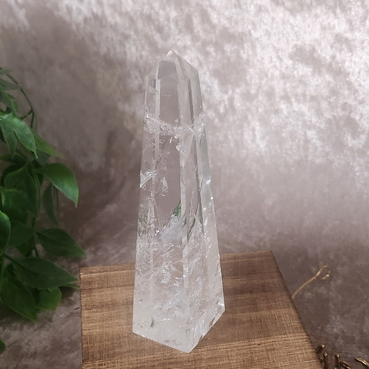 Polished clear quartz tower from Brazil on wooden display box