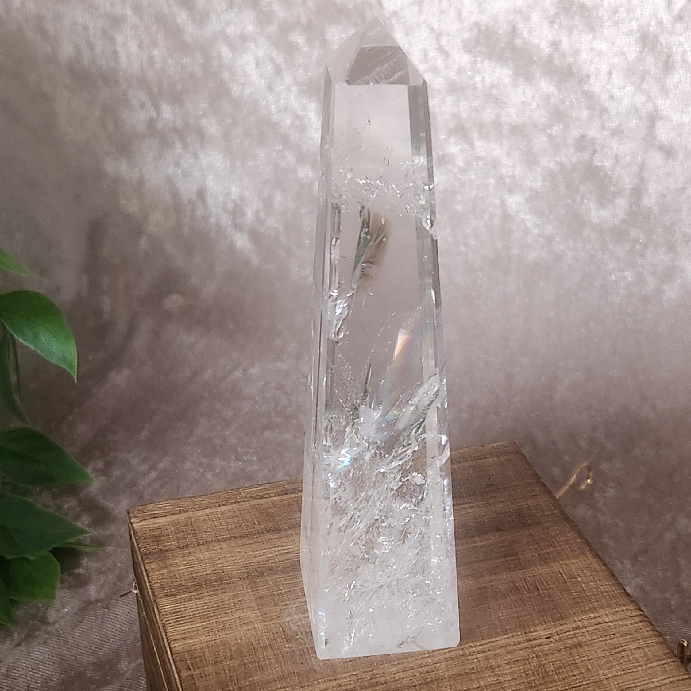 Clear quartz crystal tower showcasing organic fractures and clarity