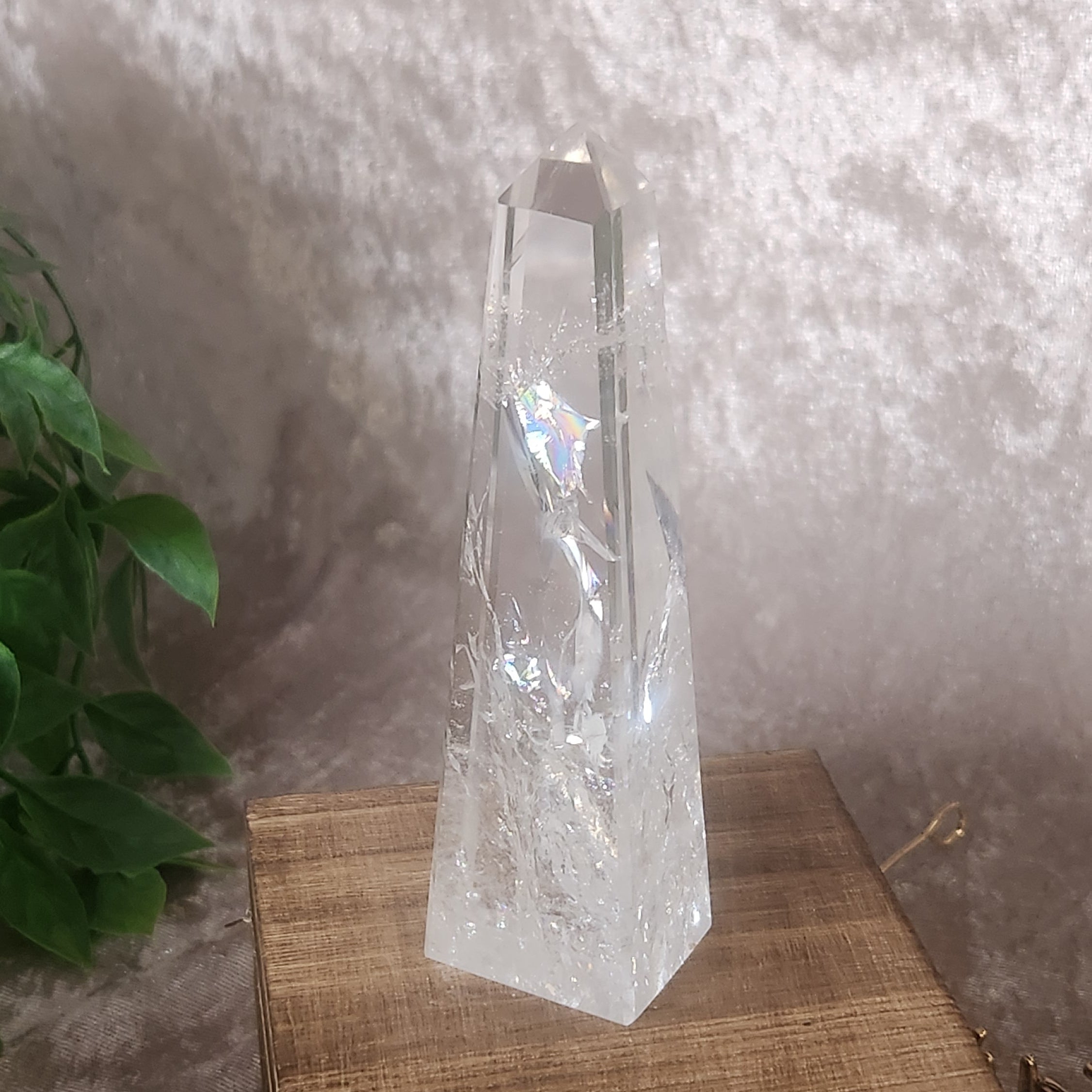 Clear quartz tower crystal highlighting natural internal formations