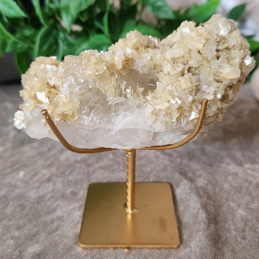 Clear Quartz with Muscovite Mica specimen on metal display stand