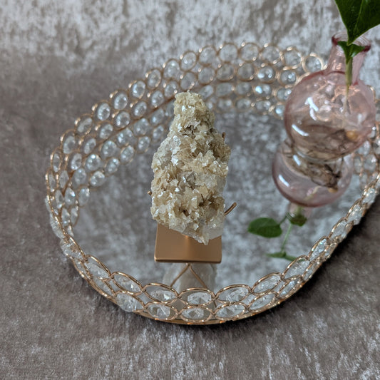 Brazilian clear quartz crystal with shimmering muscovite mica plates