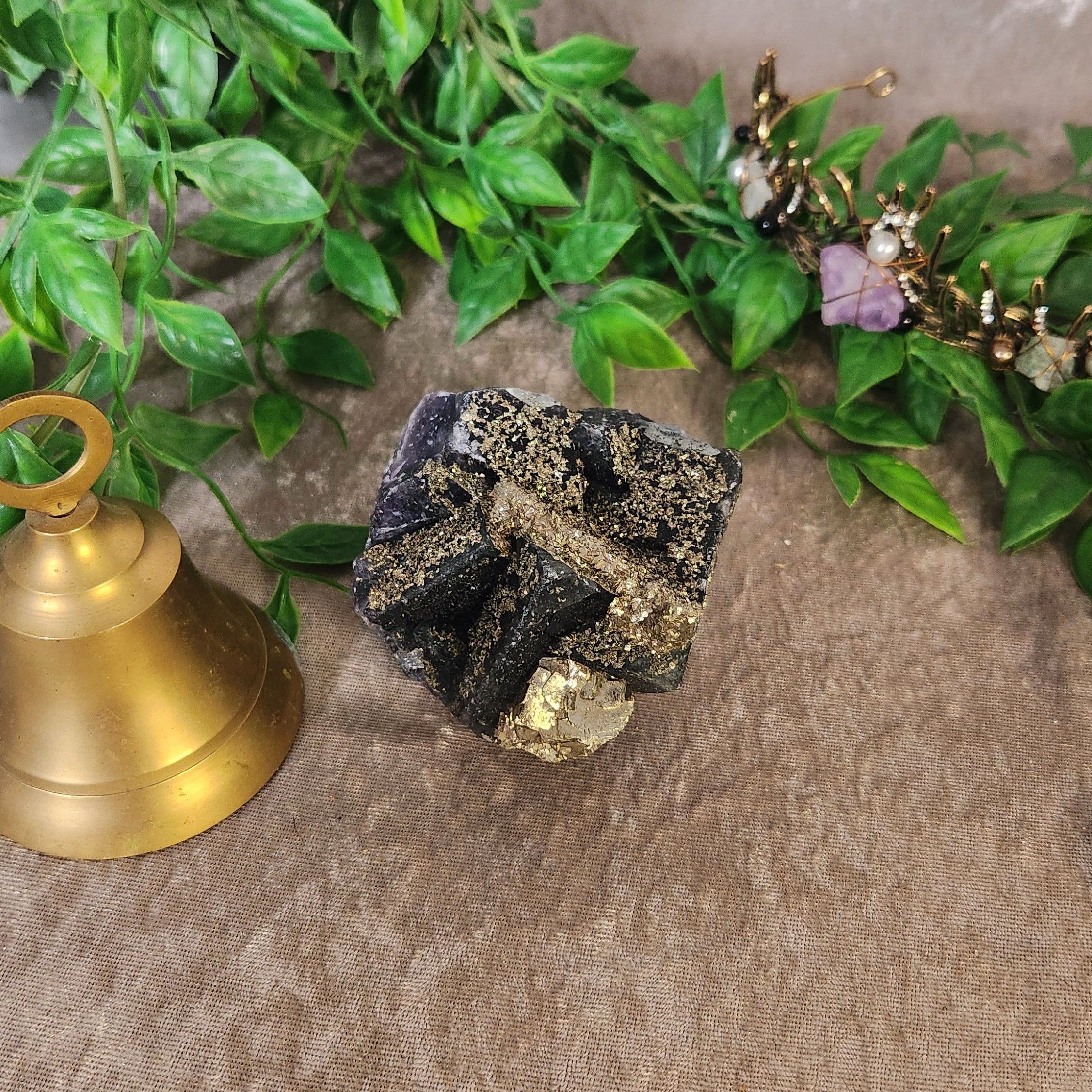 Fluorite with pyrite specimen featuring purple crystal and golden mineral accents