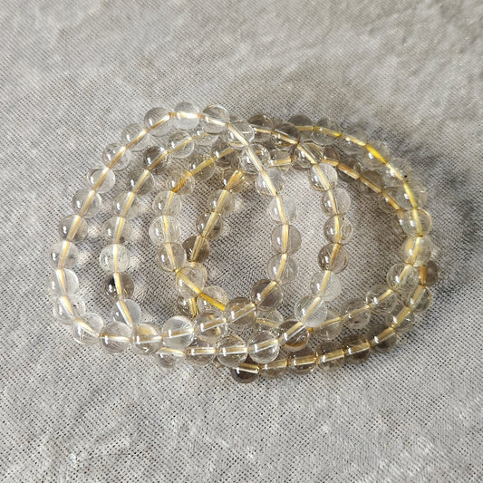 Golden Rutile Quartz bracelet with clear beads and natural golden rutile inclusions