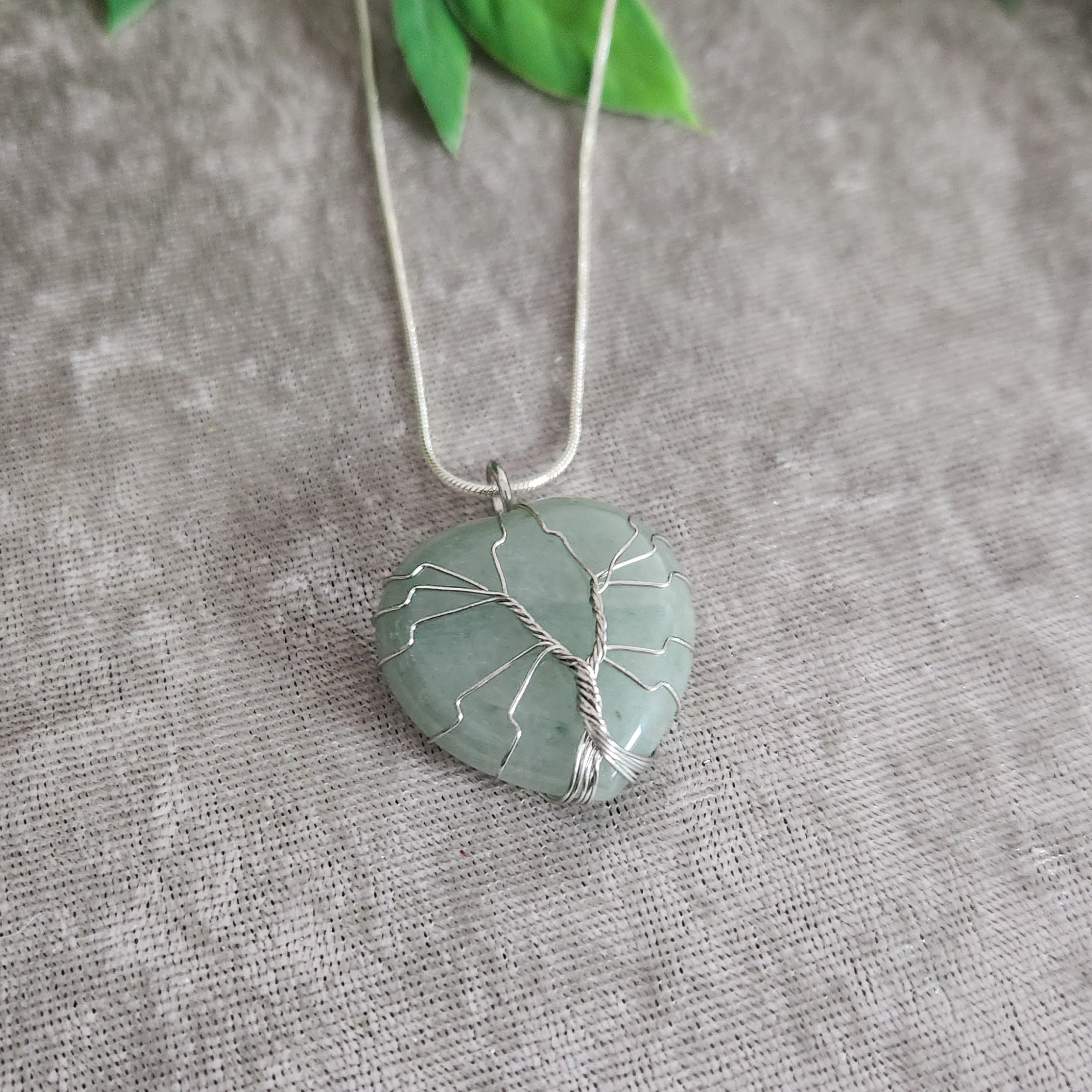 Green aventurine necklace with heart shape and soft green tones