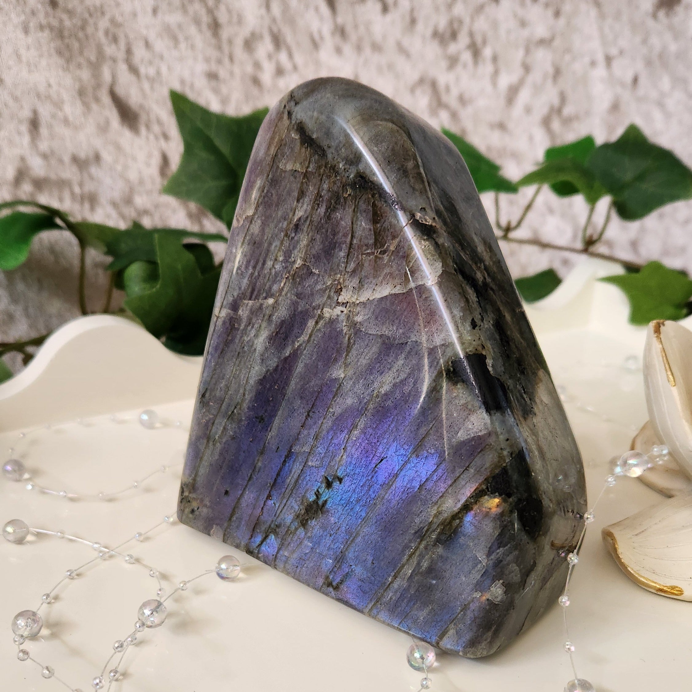 1.3kg Labradorite Freeform. Full flash across the front. Stunning purple, blue, pink and golden colours