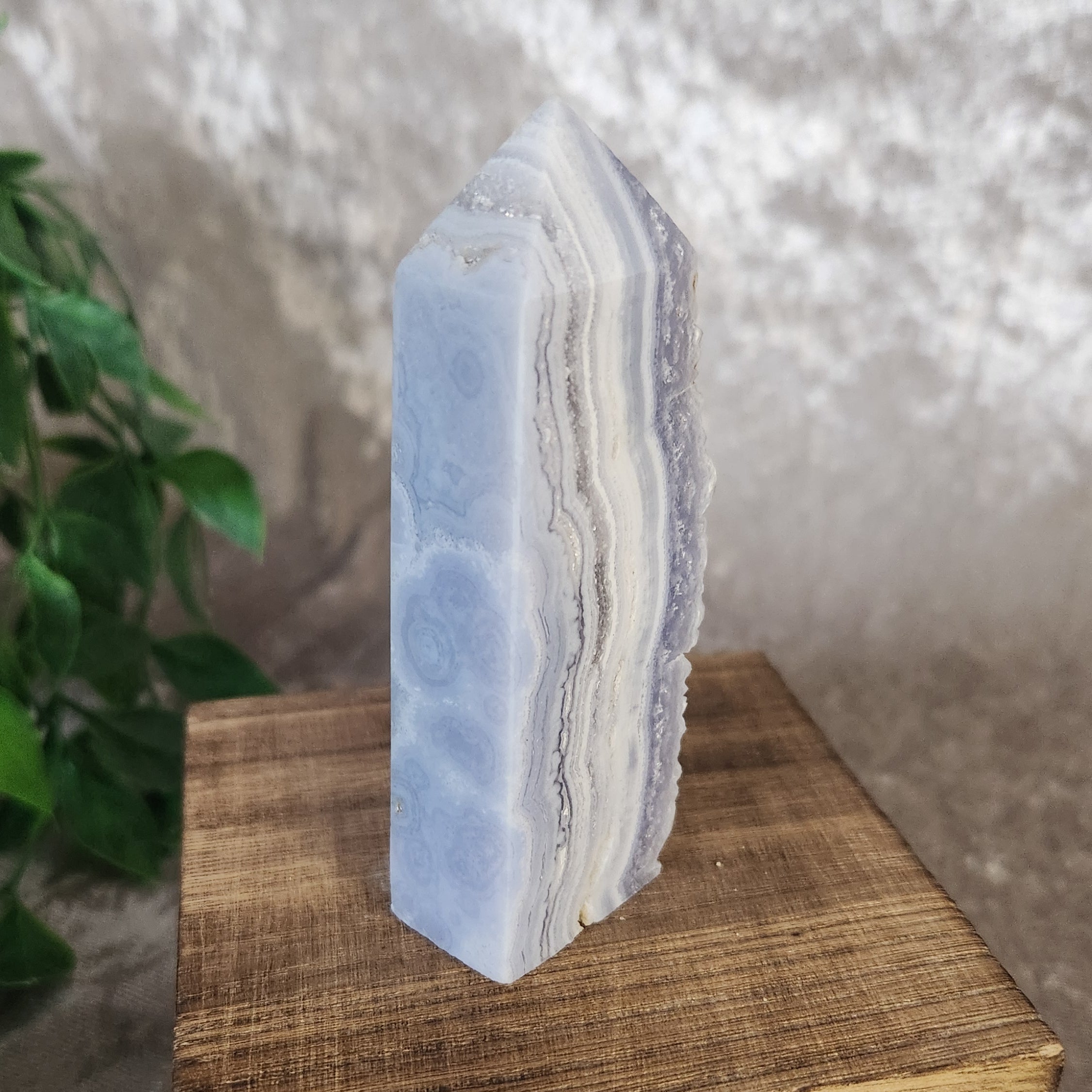 Blue lace agate tower featuring soft blue and white banding with a natural druzy quartz cavity on one side