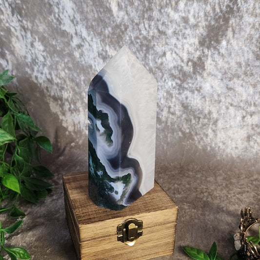 Polished parallax moss agate tower with dramatic depth and green moss patterns throughout the stone