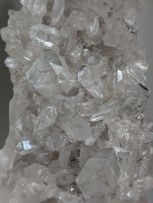 Close-up of Light Smoky Lemurian Quartz points highlighting natural Lemurian striations and clarity.