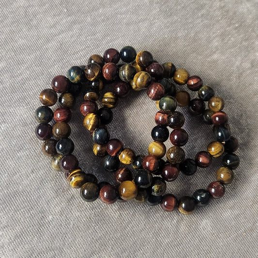 Mixed Tiger Eye bracelet photographed on a neutral background
