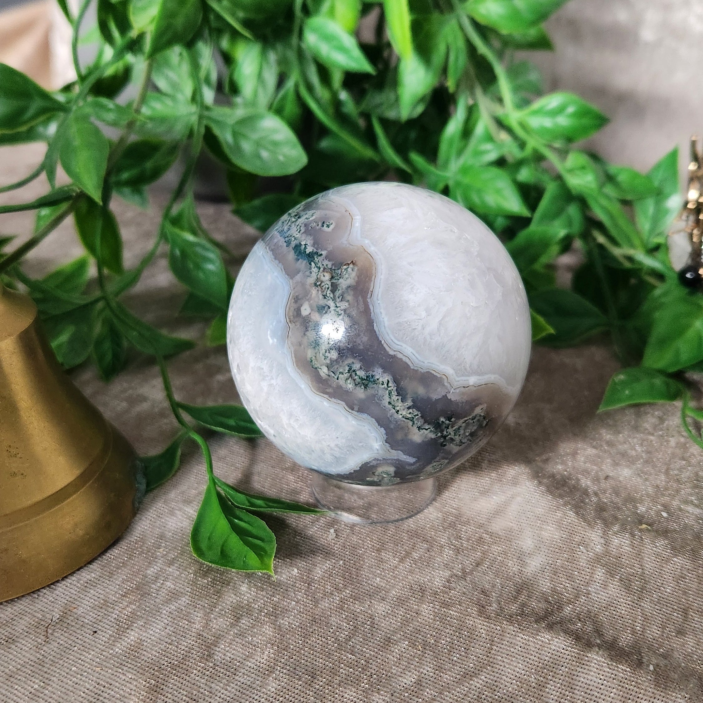 Moss Agate sphere with natural green inclusions and polished finish