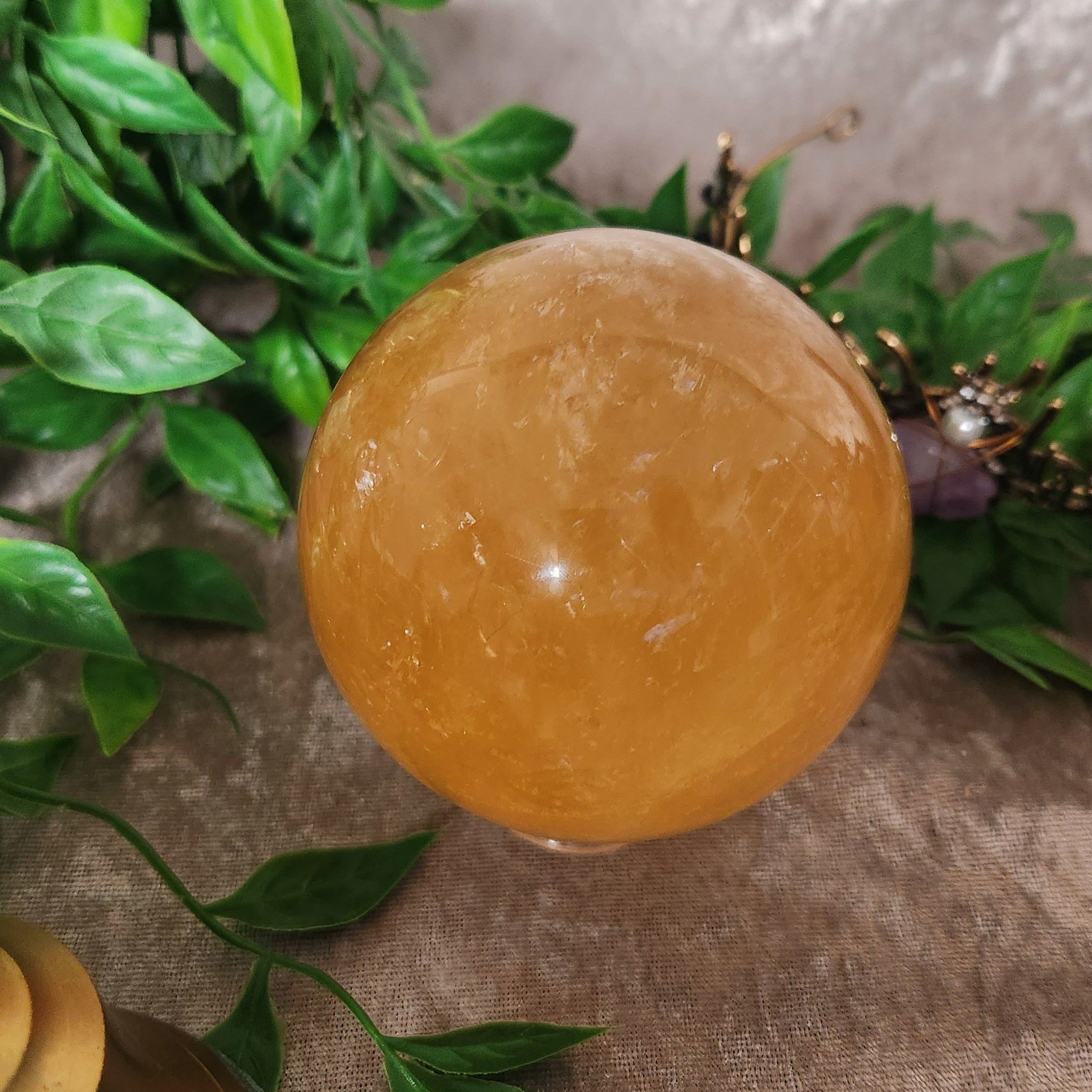 Golden Calcite polished sphere from Spellbound Crystal Boutique