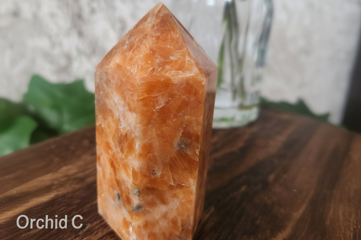 Orchid calcite crystal generator showcasing natural colour variation and tourmaline inclusions