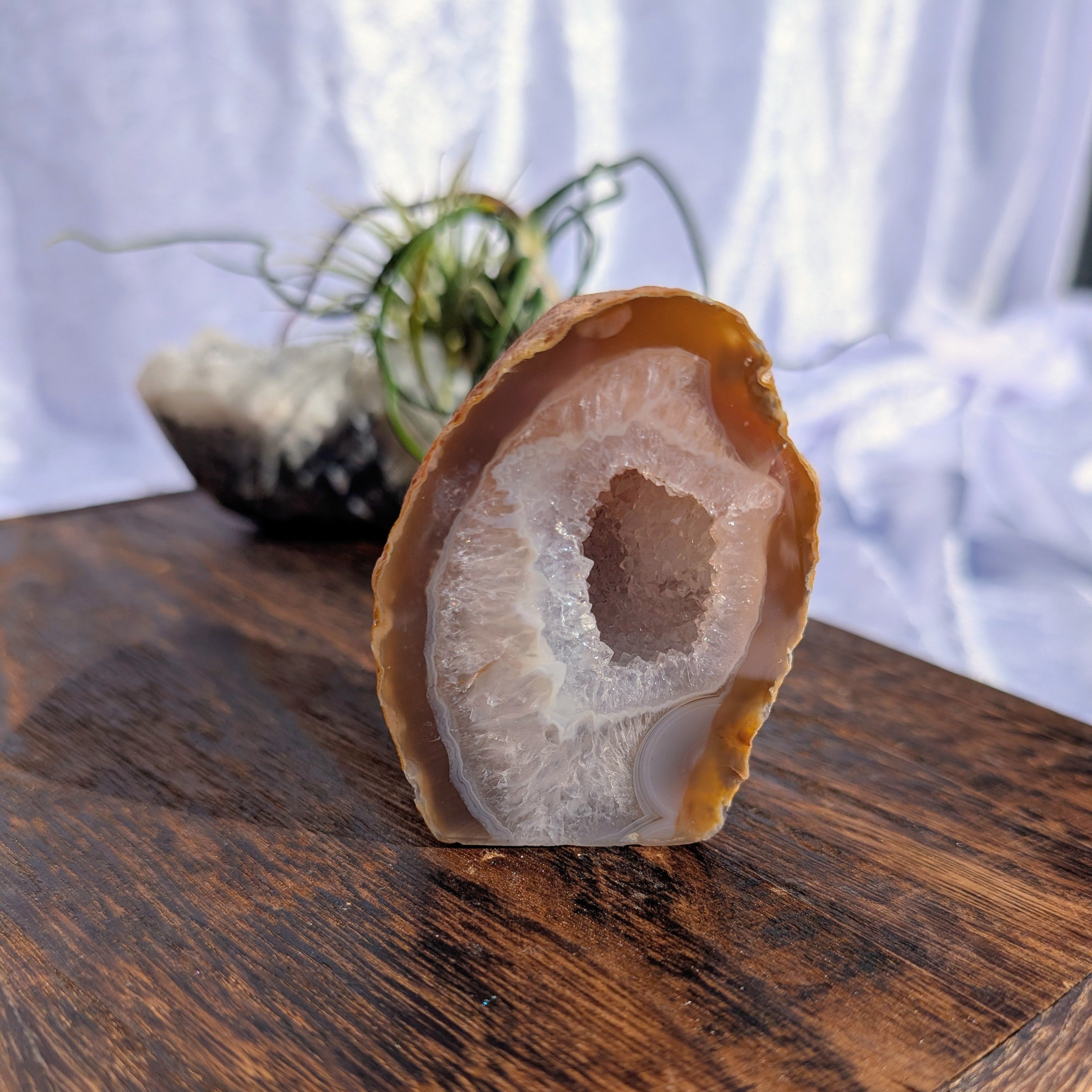 Red agate geode with large quartz druzy 