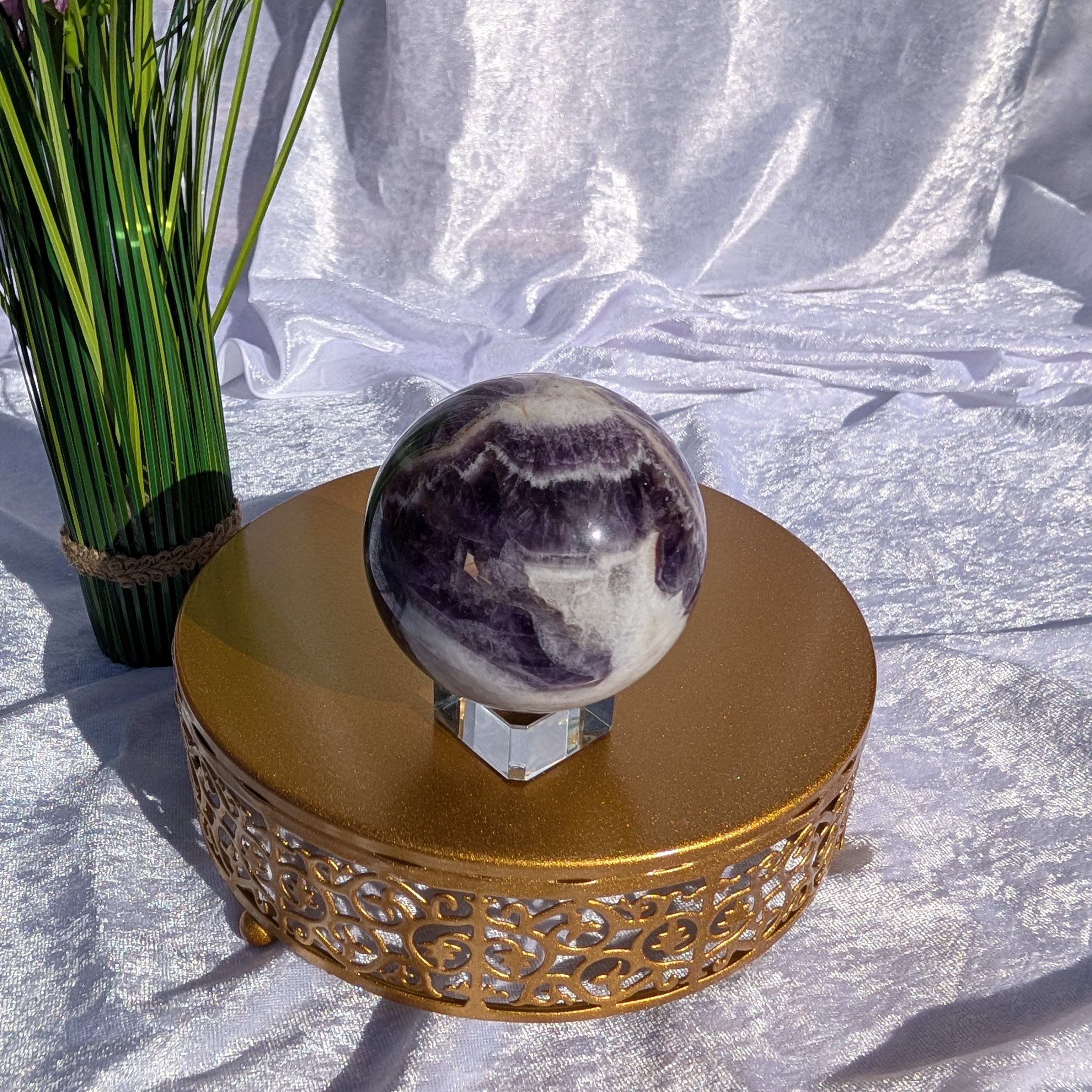 Dream Amethyst Sphere with unusual yet striking banding making a sought after piece for Boho Style decor