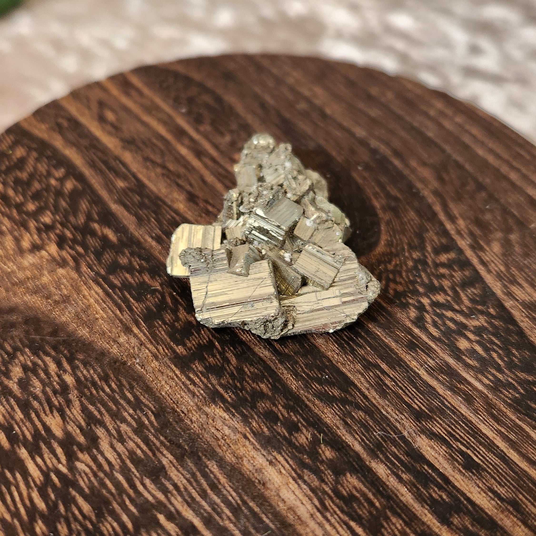 High quality Peruvian Pyrite Cluster displayed on wooden circular stand