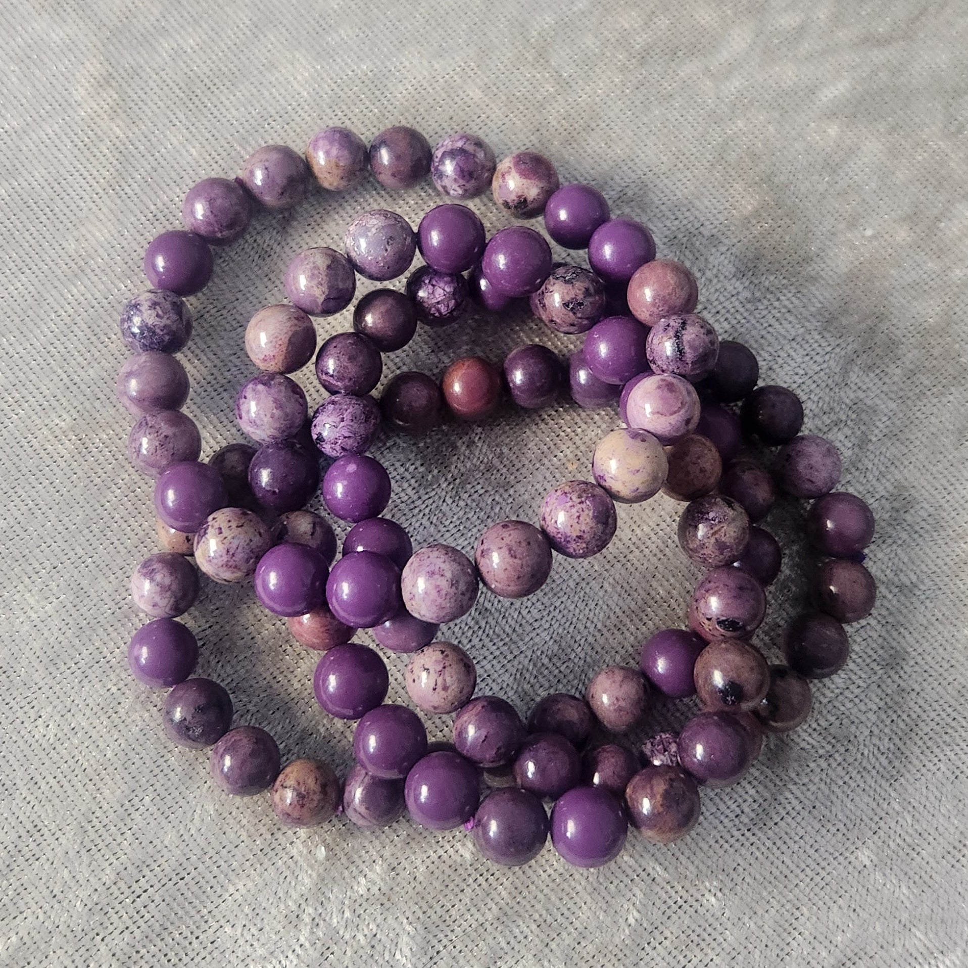 Natural Phosphosiderite crystal bracelet displayed on a neutral background