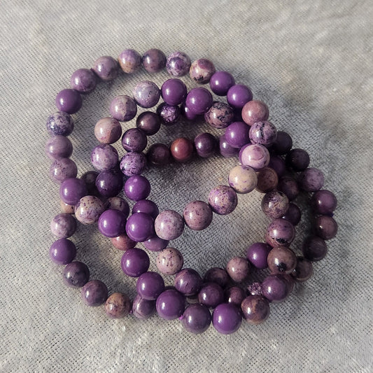 Natural Phosphosiderite crystal bracelet displayed on a neutral background