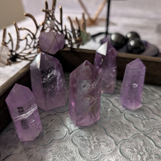 High-quality Brazilian amethyst mini crystal towers with rich purple tones and polished points