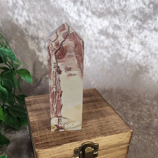 Polished Picture Jasper crystal tower displayed on wooden box
