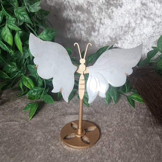 Quartz butterfly display with crystal wings mounted on gold metal stand for spiritual home decor