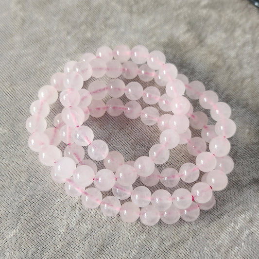 Natural Rose Quartz bracelet displayed on a neutral background