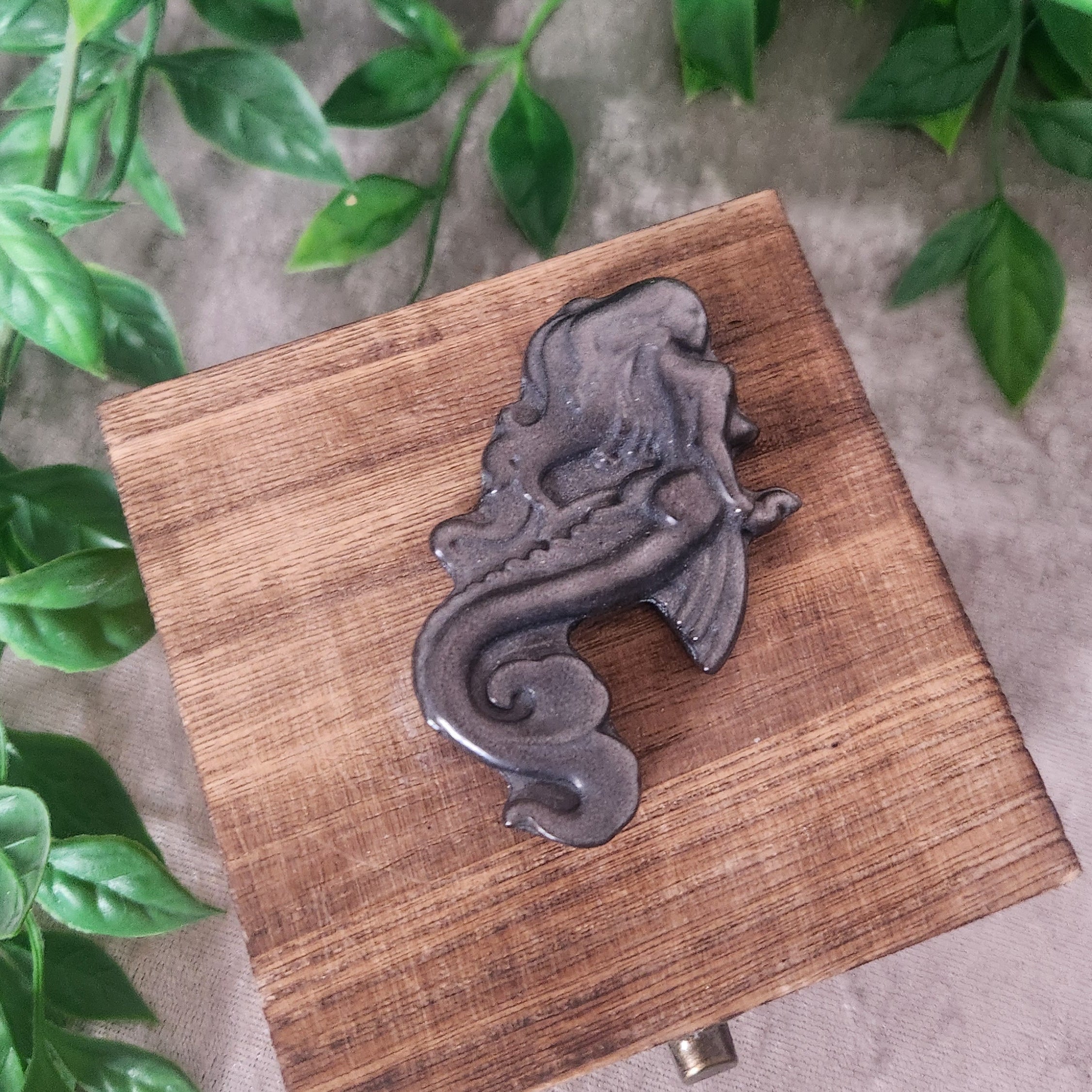 Silver obsidian mermaid carving polished with subtle silver sheen