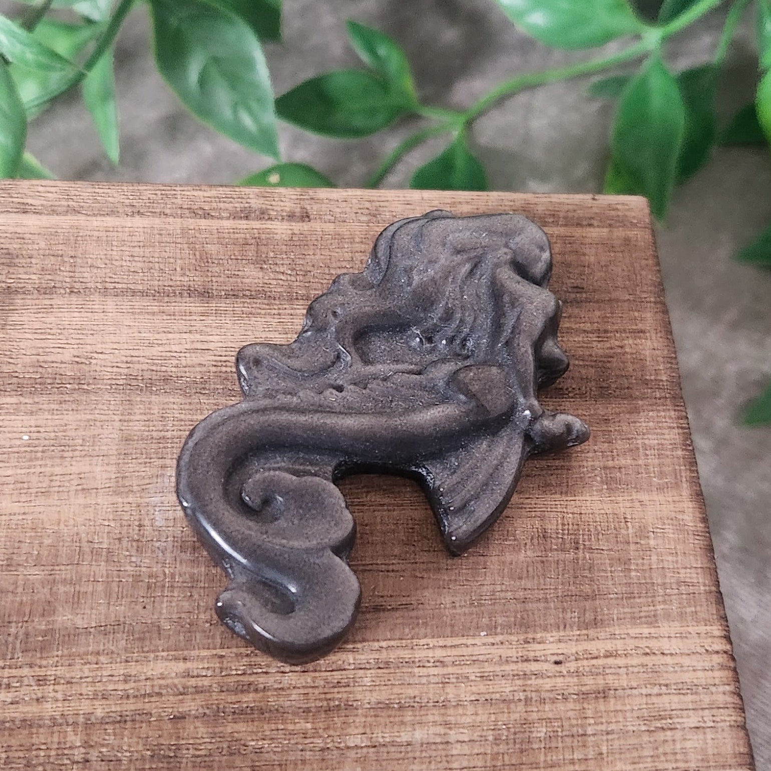 Small silver obsidian mermaid carving with smooth polished finish